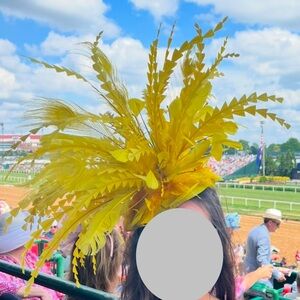 Yellow Fascinator. Huge. Over the top. Kentucky Derby. Preakness.